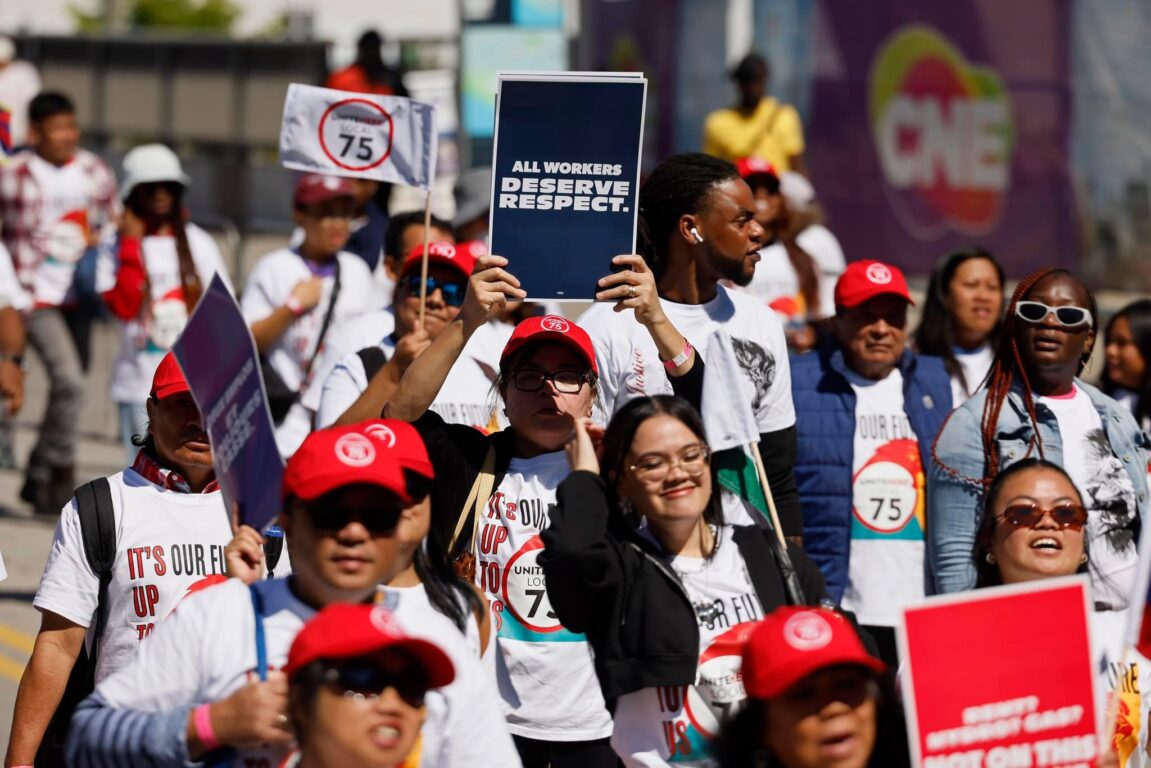 People holding signs at a Workers Together rally